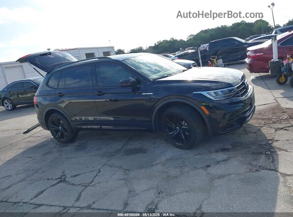 3VVCB7AX0PM107571 2023 VOLKSWAGEN TIGUAN Black Rear interior view