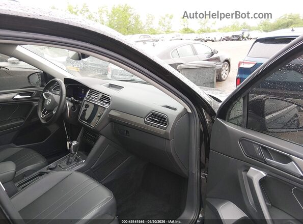 3VVMB7AX6PM006572 2023 VOLKSWAGEN TIGUAN Black Widok wnętrza z przodu