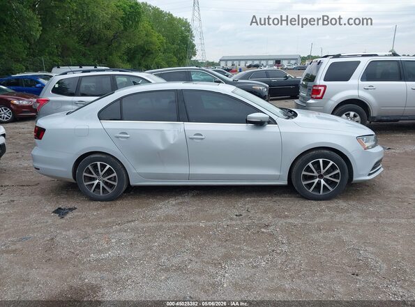 3VWDB7AJ8HM388922 2017 VOLKSWAGEN JETTA Silver Rear interior view