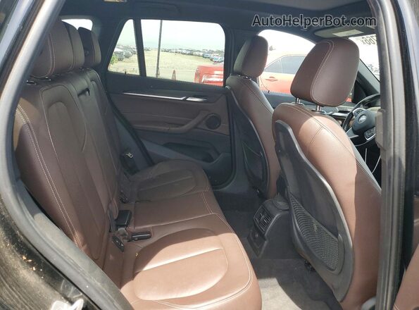 WBXHT3Z37H4A56438 2017 BMW X1 Black Vista del compartimento del motor