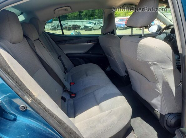 4T1DAACK6SU146704 2025 TOYOTA CAMRY Blue Vista de los asientos traseros