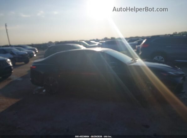 4T1DAACK9SU529326 2025 TOYOTA CAMRY Black Սալոնի հետևի տեսք