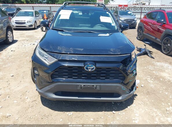 4T3R6RFV2MU014691 2021 TOYOTA RAV4 HYBRID Black Вид задньої частини салону
