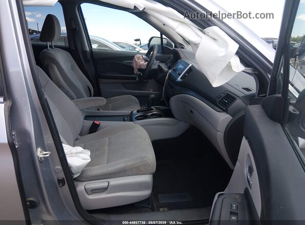 5FNYF6H14KB097662 2019 HONDA PILOT Серебряный Вид салона спереди