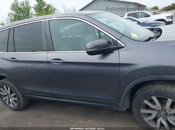 5FNYF6H37KB083644 2019 HONDA PILOT Gray Rear interior view