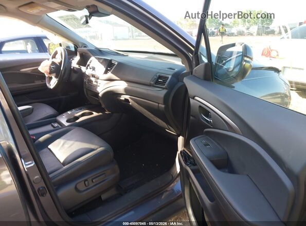 5FNYF6H59MB094858 2021 HONDA PILOT Gray Front interior view