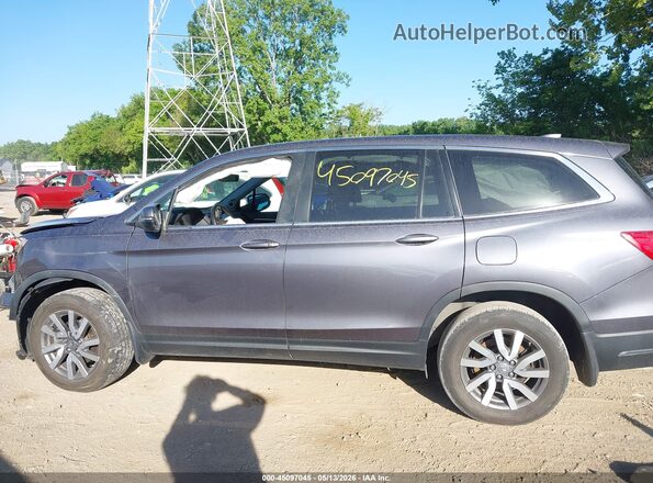 5FNYF6H59MB094858 2021 HONDA PILOT Gray 360 interior view