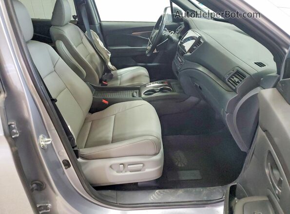 5FNYF8H54PB034339 2023 HONDA PASSPORT Серебряный Вид салона спереди