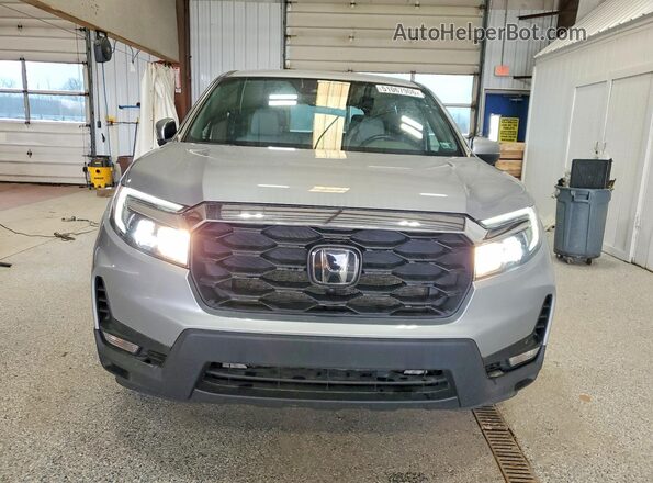 5FNYF8H54PB034339 2023 HONDA PASSPORT Серебряный Вид спереди