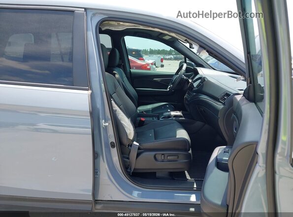 5FNYF8H56PB033709 2023 HONDA PASSPORT Blue Vista interior delantera