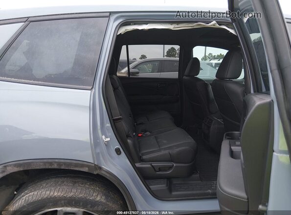 5FNYF8H56PB033709 2023 HONDA PASSPORT Blue Vista de la etiqueta del VIN
