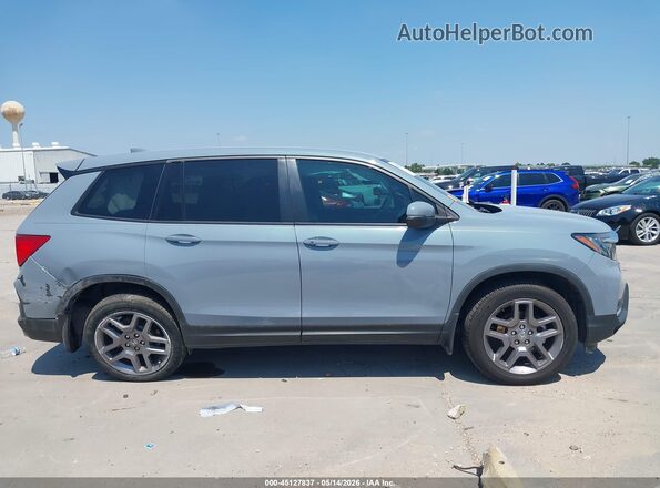5FNYF8H56PB033709 2023 HONDA PASSPORT Blue Vista interior trasera