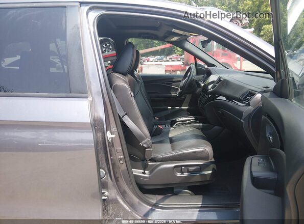 5FNYF8H90MB024034 2021 HONDA PASSPORT Gray Front interior view