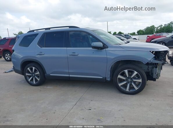 5FNYG2H78SB046952 2025 HONDA PILOT Blue Rear interior view