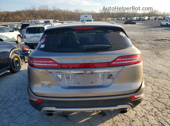 5LMCJ3C9XKUL15544 2019 LINCOLN MKC Tan Հետևի տեսք