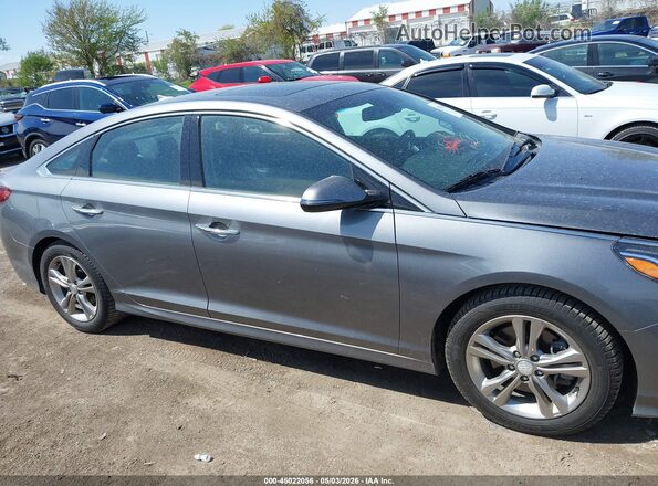 5NPE34AF0KH770454 2019 HYUNDAI SONATA Gray Rear interior view