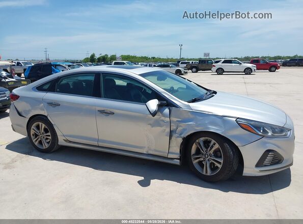 5NPE34AF4KH813192 2019 HYUNDAI SONATA Серебряный Вид задней части салона