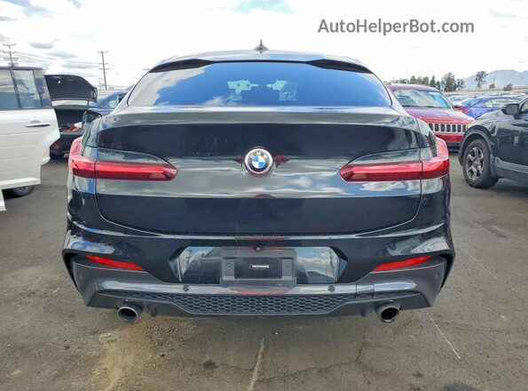 5UX2V1C02L9B14613 2020 BMW X4 Black Rear view