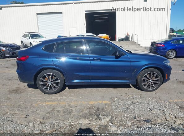 5UX2V5C04L9B53338 2020 BMW X4 Blue Rear interior view