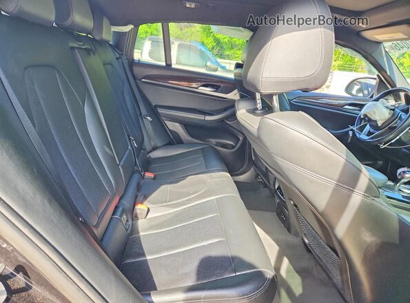 5UX33DT06P9P69470 2023 BMW X4 Black Vista interior trasera