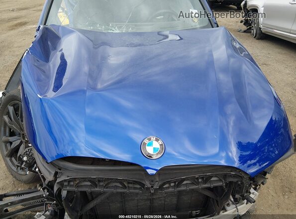 5UX33EM00R9T36170 2024 BMW X7 Blue Вид ззаду