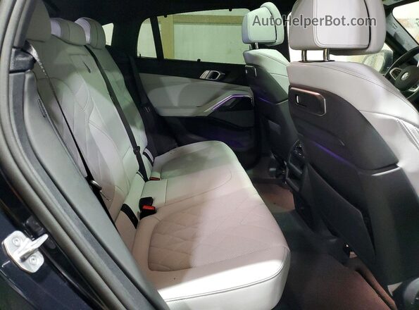 5UX33EX04R9W10028 2024 BMW X6 Blue Rear interior view