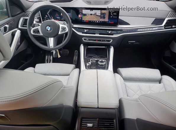 5UX33EX04R9W10028 2024 BMW X6 Blue Dashboard view