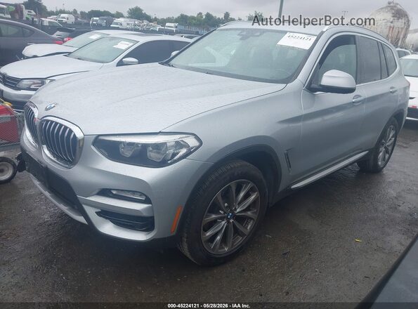 5UXTR7C51KLR44960 2019 BMW X3 Gray Vista tres cuartos delantera izquierda