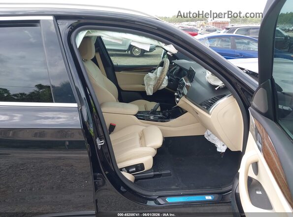 5UXTY3C09M9G01283 2021 BMW X3 Black Vista interior delantera