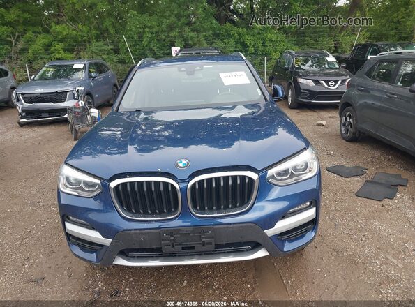 5UXTY5C02M9E07061 2021 BMW X3 Blue Vista interior trasera