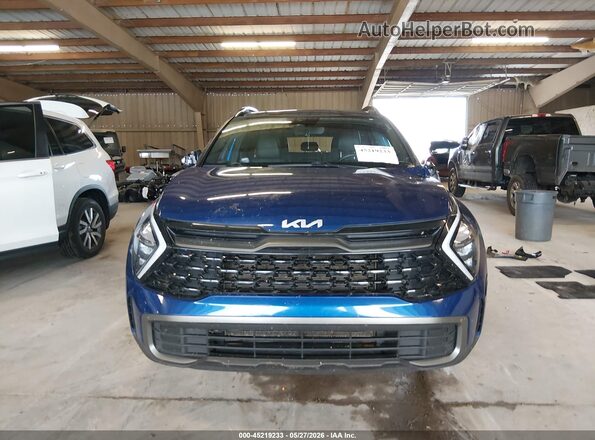 5XYK6CAF8PG034302 2023 KIA SPORTAGE Blue Widok wnętrza z tyłu