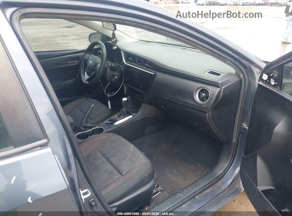 5YFBURHE2KP936261 2019 TOYOTA LL Gray Front interior view