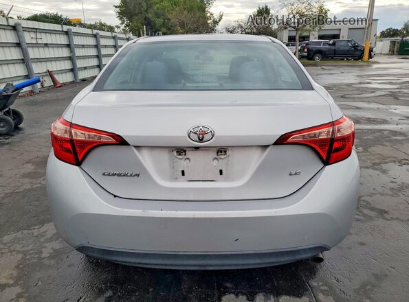 5YFBURHE4JP791674 2018 TOYOTA COROLLA Silver Vista trasera