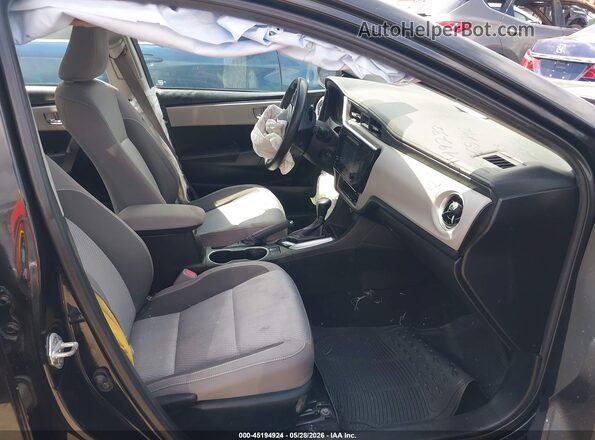 5YFBURHE4KP865242 2019 TOYOTA COROLLA Черный Вид салона спереди