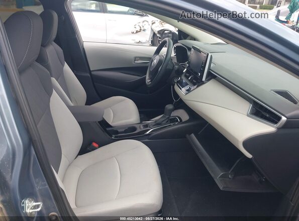 5YFEPMAE9MP149599 2021 TOYOTA COROLLA Blue Widok wnętrza z przodu