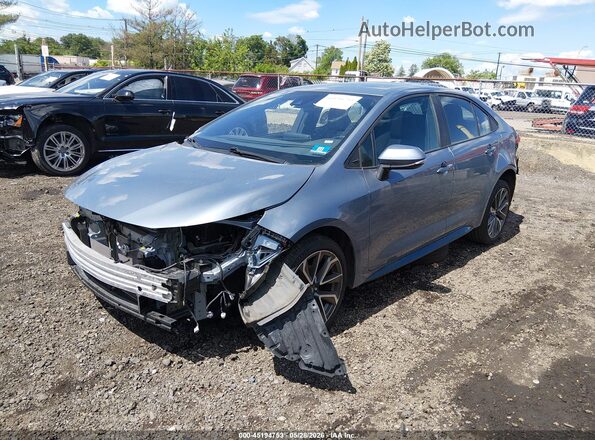 5YFP4MCE6MP069692 2021 TOYOTA COROLLA Blue Vista tres cuartos delantera izquierda