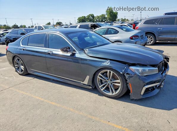WBA7E4C51KGV28667 2019 BMW 7 SERIES Gray Вид спереду