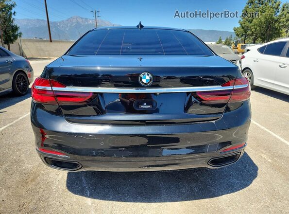 WBA7F0C59GGM20875 2016 BMW 7 SERIES Black Front interior view