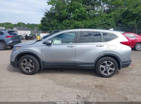 7FARW2H58KE027554 2019 HONDA CR-V Silver Rear interior view