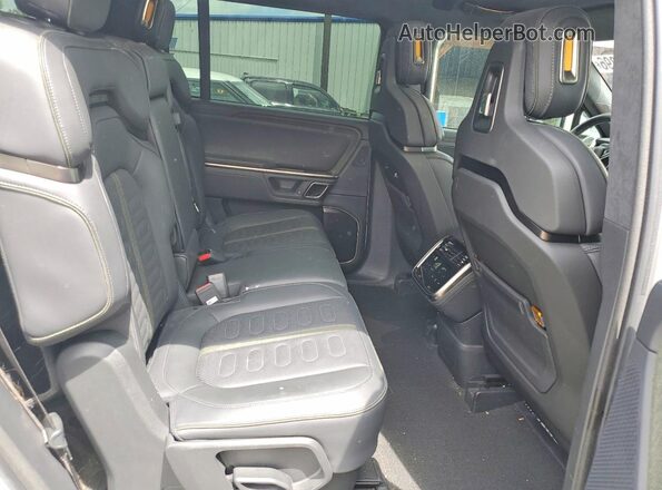 7PDSGCBAXRN031597 2024 RIVIAN R1S White Вид задньої частини салону
