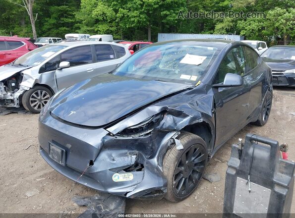 7SAYGAEE1PF835760 2023 TESLA MODEL Y Gray Vista tres cuartos delantera izquierda