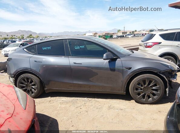 7SAYGAEE2PF668955 2023 TESLA MODEL Y Gray Սալոնի հետևի տեսք