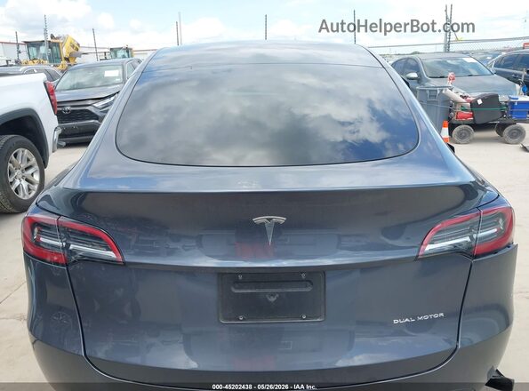 7SAYGAEEXPF941527 2023 TESLA MODEL Y Gray Սալոնի 360 աստիճան տեսք