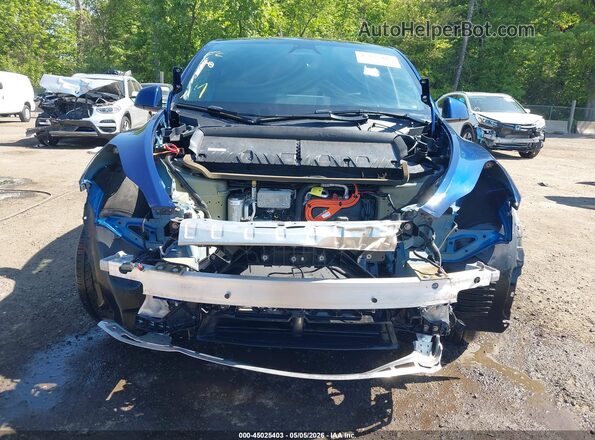 7SAYGAEEXRF060362 2024 TESLA MODEL Y Blue Vista interior trasera