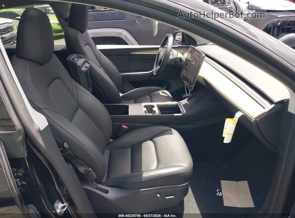 7SAYGDED1SF321375 2025 TESLA MODEL Y Black Front interior view