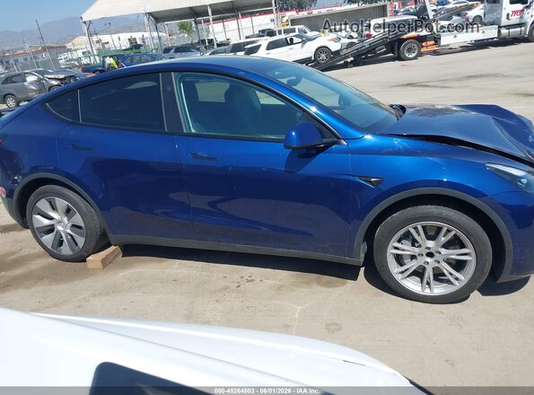 7SAYGDED2RF003579 2024 TESLA MODEL Y Blue Սալոնի հետևի տեսք