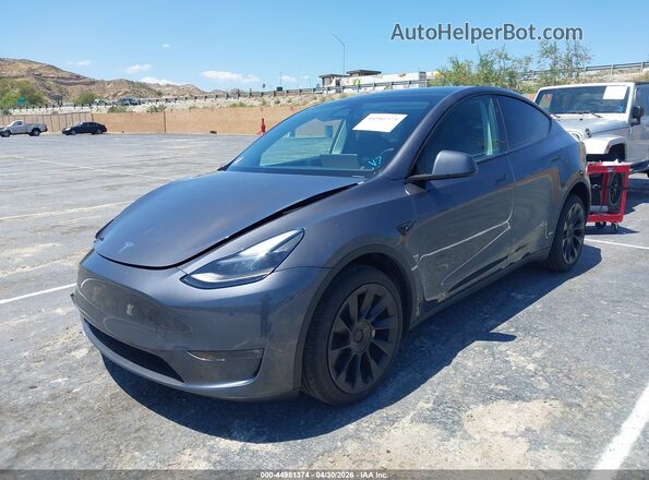 7SAYGDEE1PF891361 2023 TESLA MODEL Y Gray Առջևի ձախ երեք քառորդ տեսարան