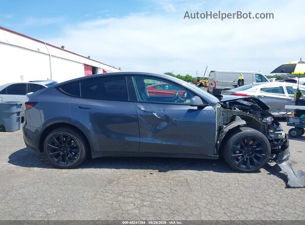 7SAYGDEE4PA098911 2023 TESLA MODEL Y Gray Widok wnętrza z tyłu