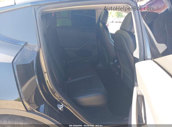7SAYGDEE4PA118705 2023 TESLA MODEL Y Black VIN sticker view