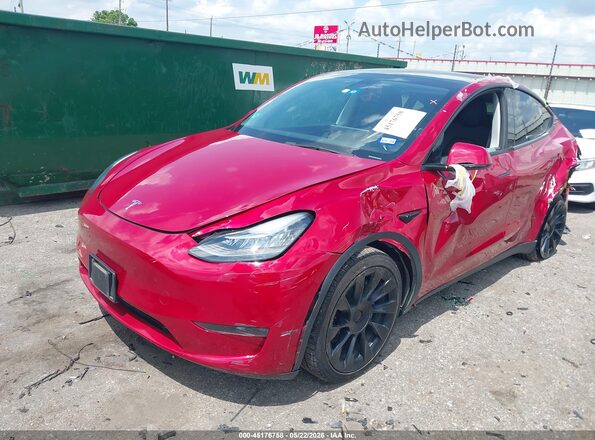 7SAYGDEE7PA129682 2023 TESLA MODEL Y Red წინა მარცხენა ხედი სამი მეოთხედიდან